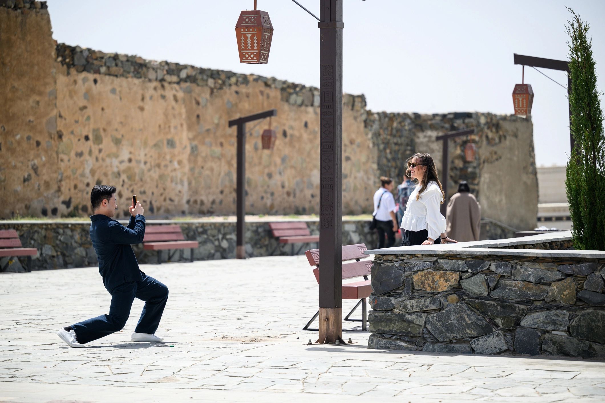 Photographer working with a client during a photo session