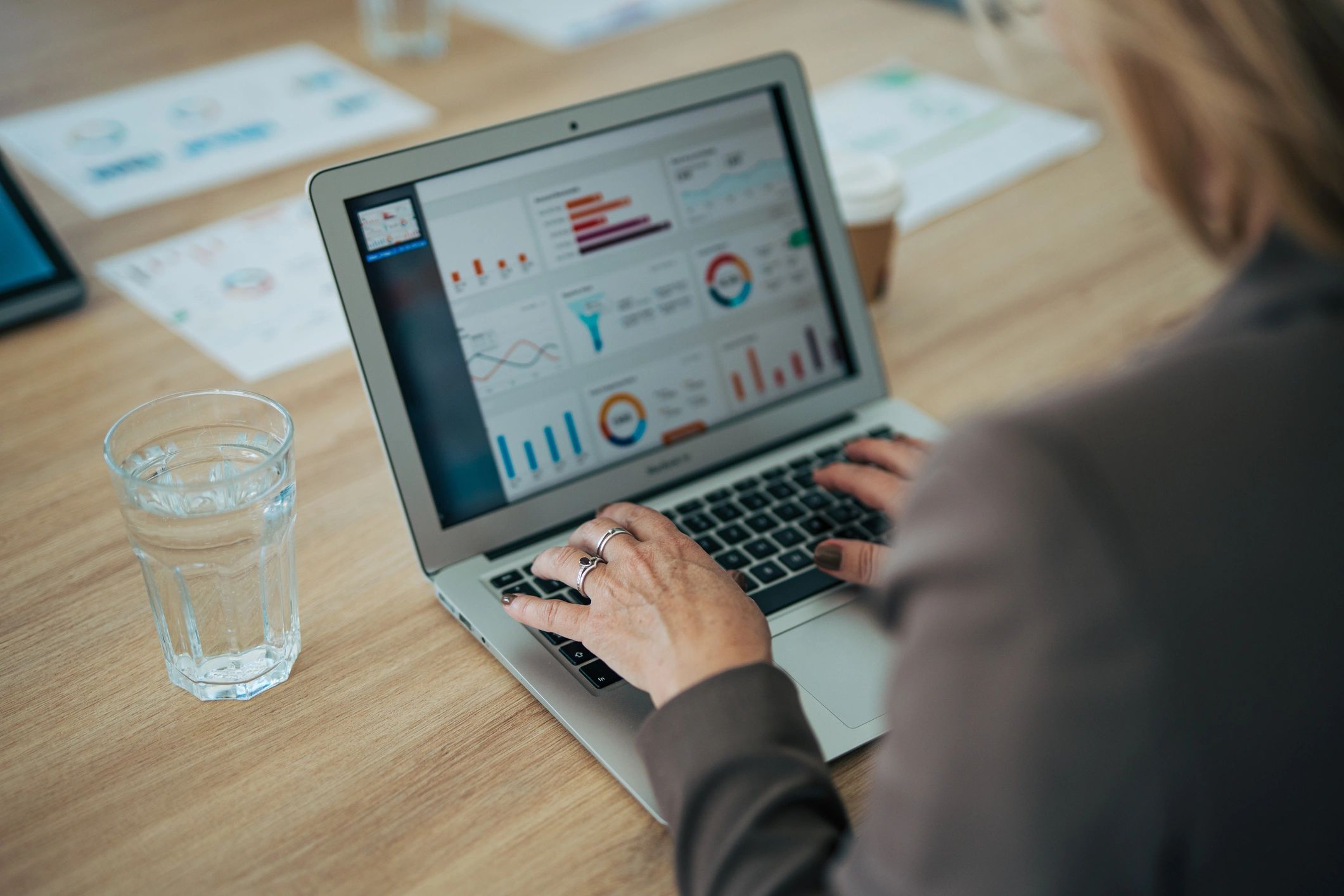 Laptop showing business dashboard in an office meeting