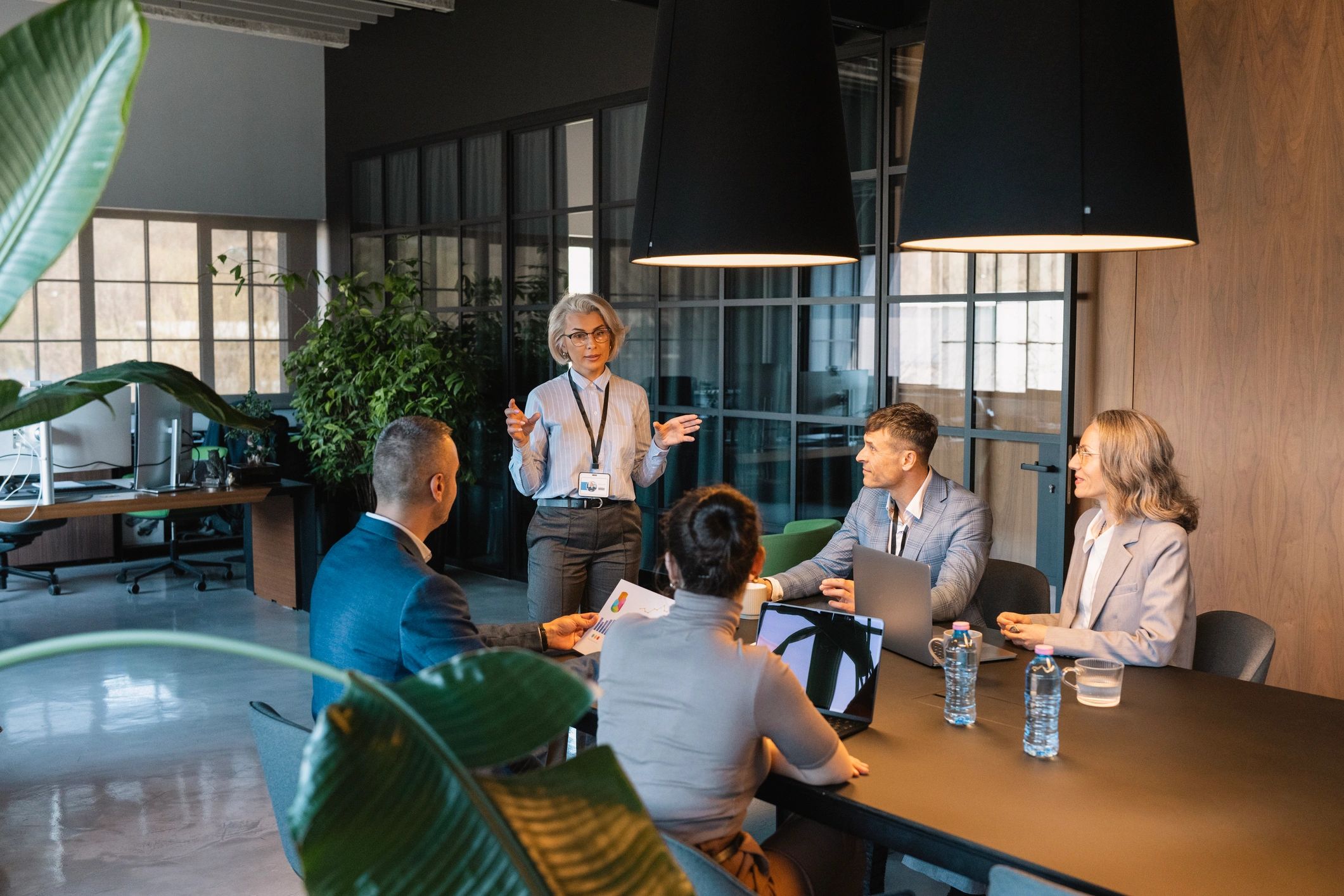 Business professional presenting to a team